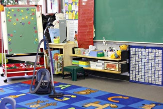 image of classroom rug with vacuum cleaner